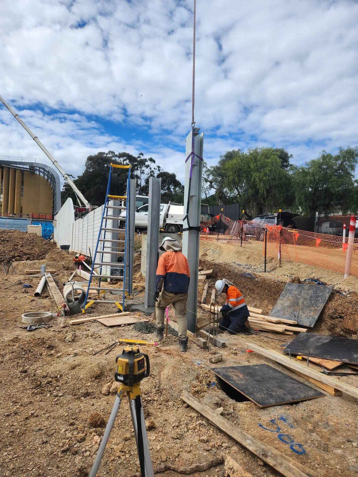Excavator on site — building retaining wall