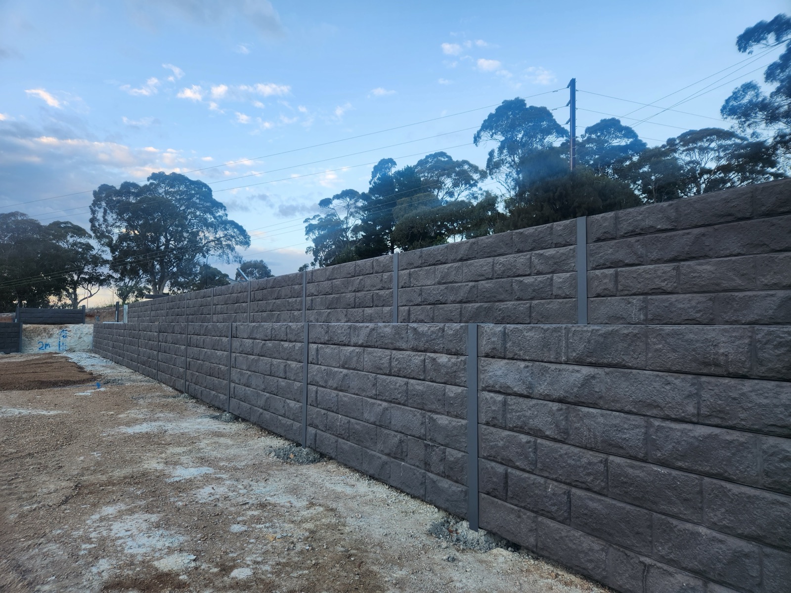 Concrete sleeper wall on sloped block, Adelaide